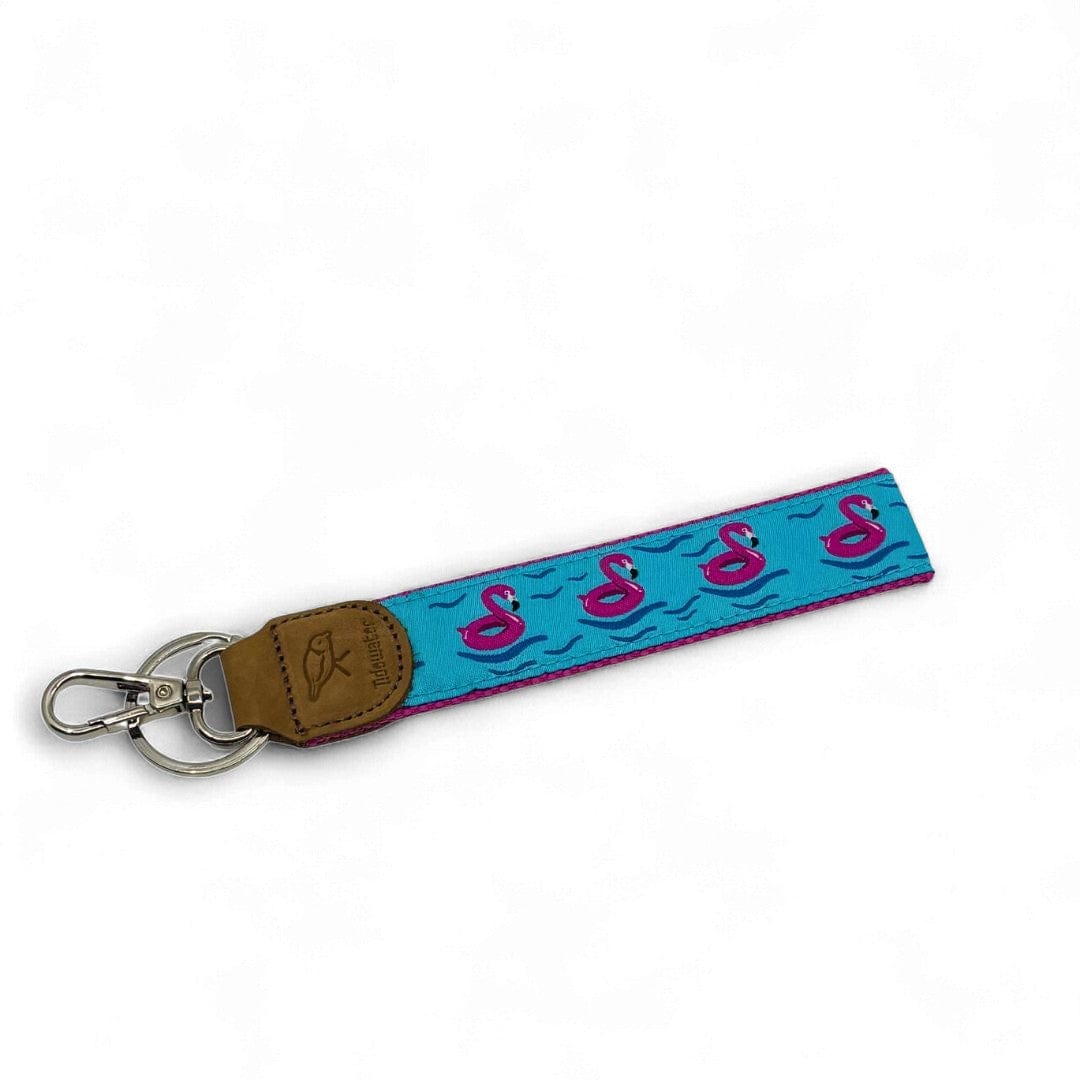 Keychain with flamingo design on a blue strap against a white background