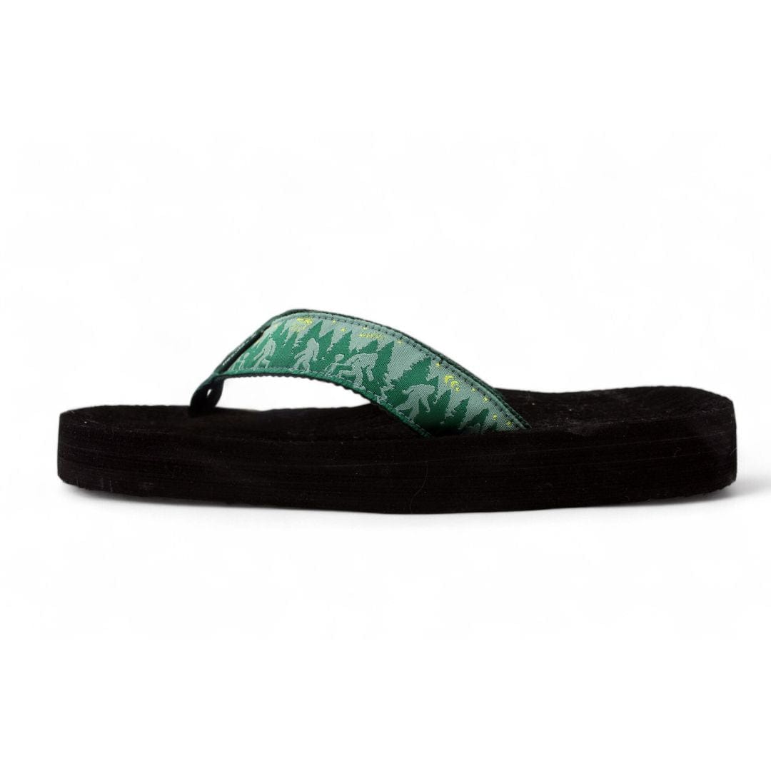 Men's Bigfoot and Co. flip-flop featuring a green forest design on the strap and a comfortable black sole.