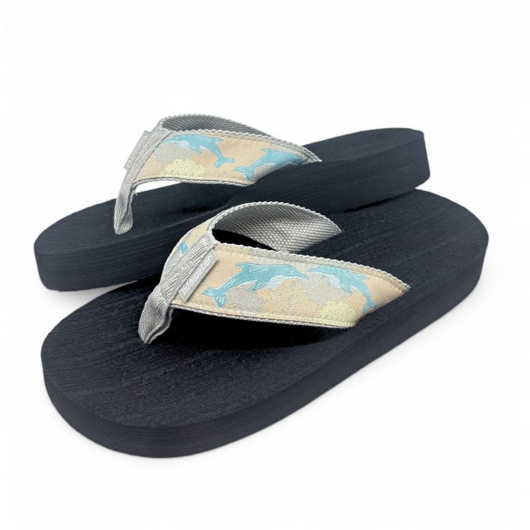 Comfortable Dolphin Way flip-flops featuring a playful dolphin design on a light strap and a sturdy black sole.
