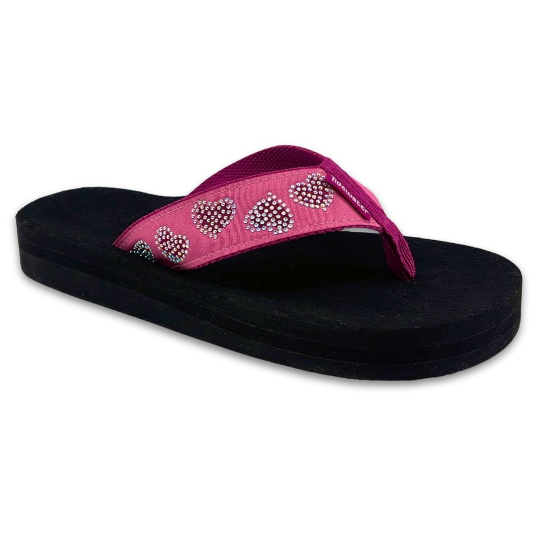 Black sandal with pink strap featuring heart designs on a white background