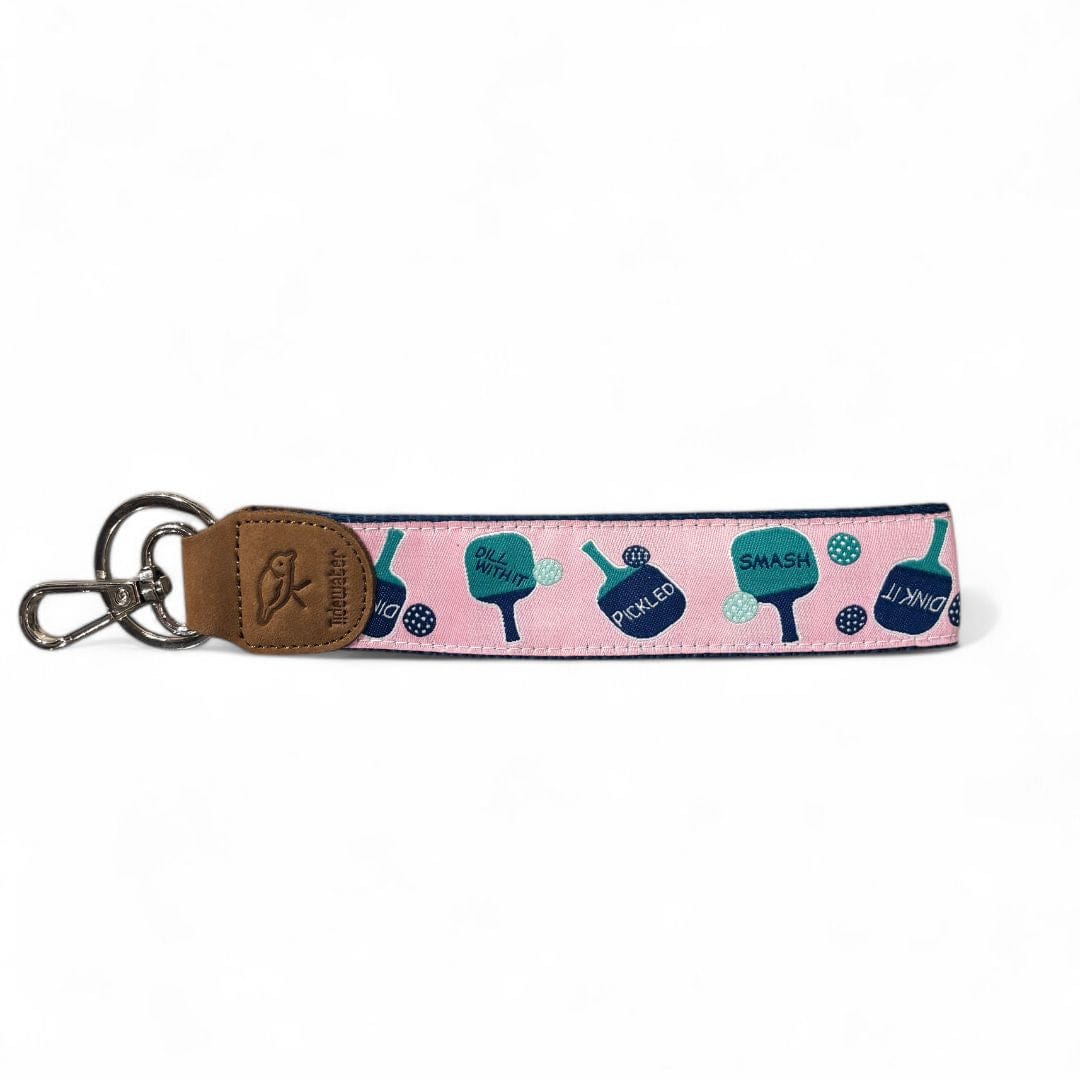 Show off your pickleball passion with this trendy pink keychain featuring playful paddle designs. Durable, functional, and perfect for everyday use!