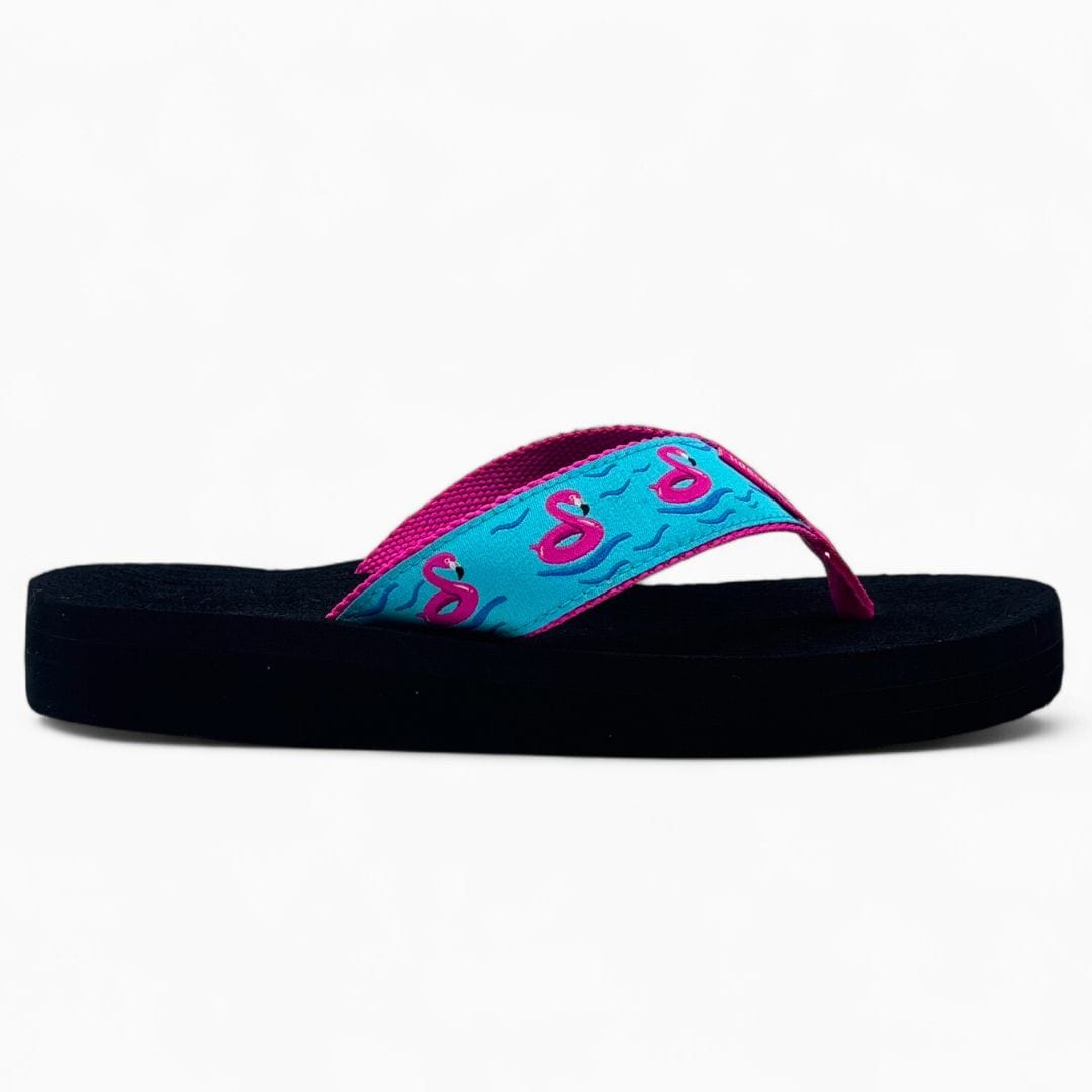Black sandal with pink and blue strap on a white background