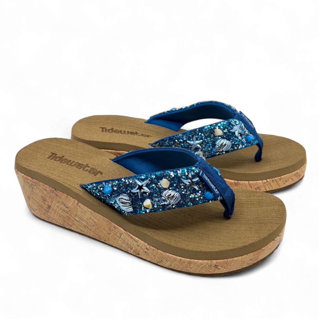 Women’s blue wedge flip flops with cork sole and glitter strap decorated with seashells, starfish, and pearls