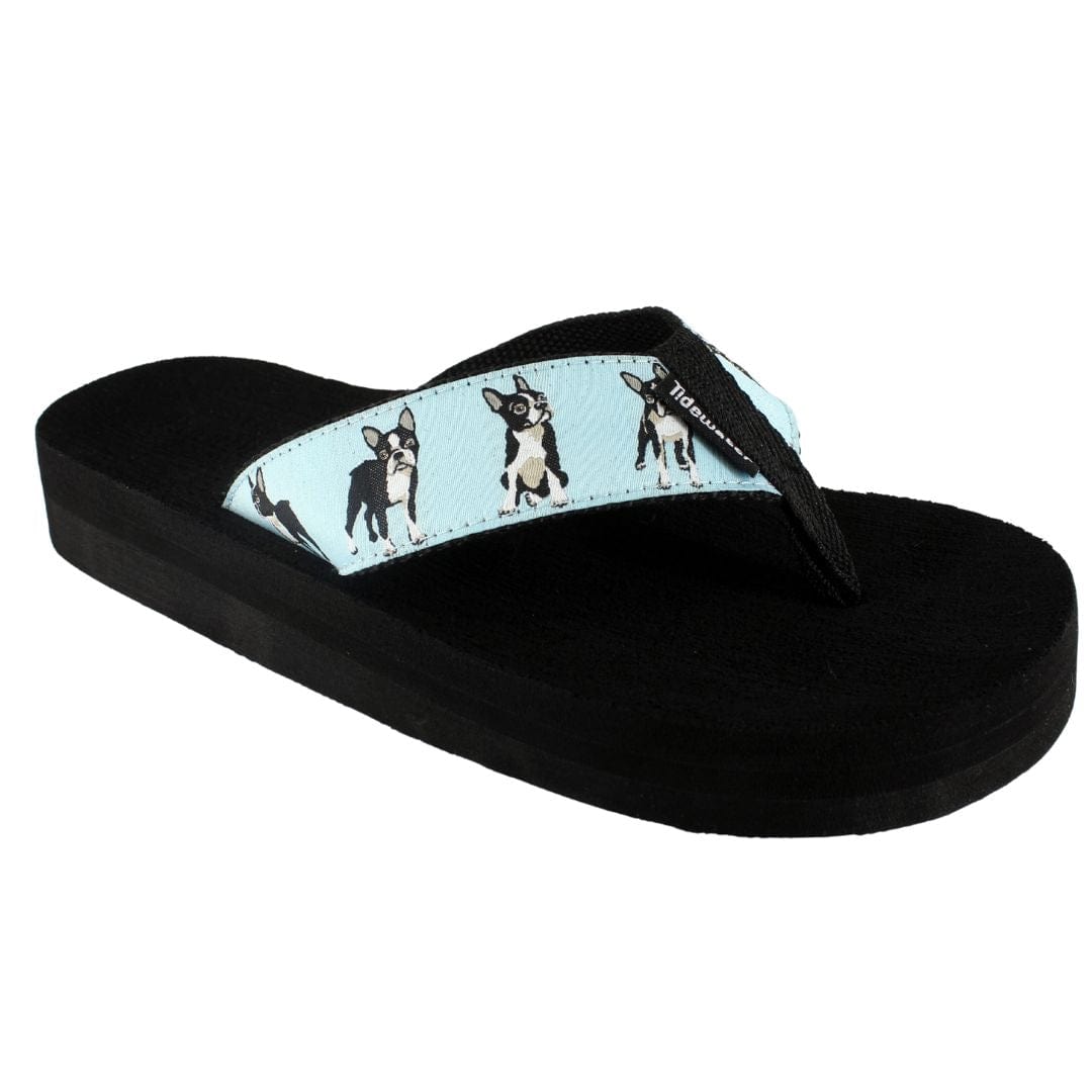 Black sandal with a blue strap featuring dog illustrations on a white background