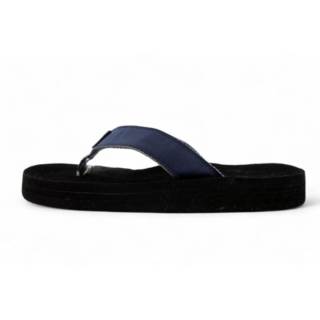Black sandal with a blue strap on a white background