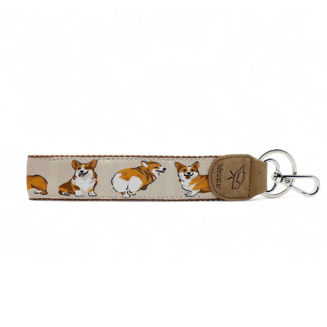 Show off your love for corgis with this adorable keychain featuring playful corgi illustrations. A perfect gift for pet lovers and dog enthusiasts!