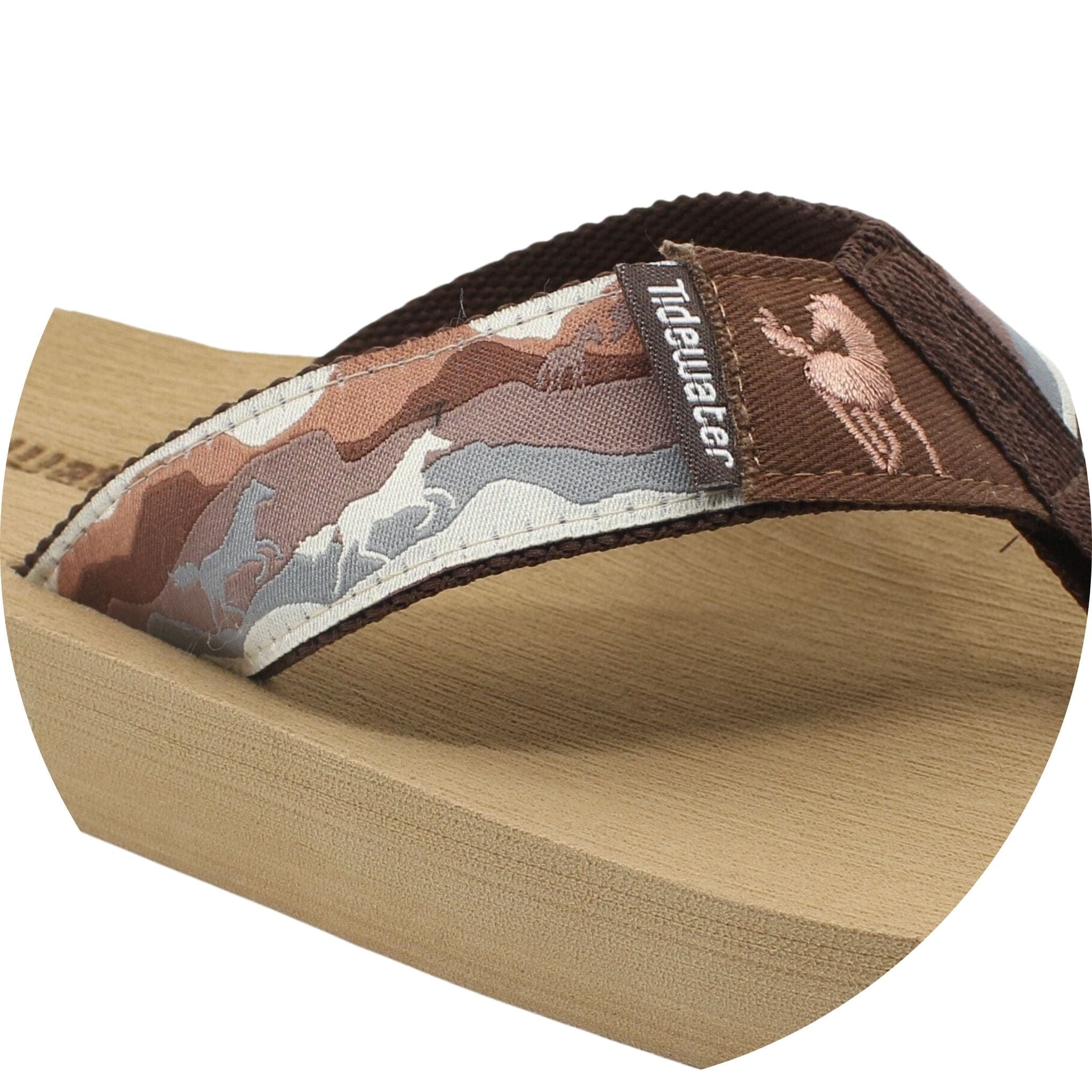 Tidewater Sandals Giddy Up features a stylish horse-themed strap and a comfortable wedge sole for casual wear.