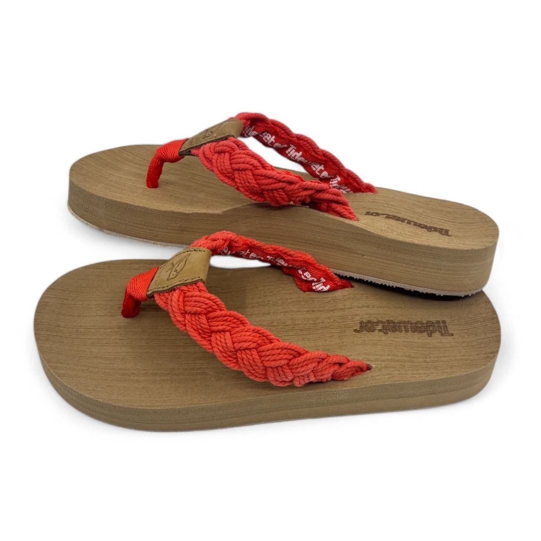 Hot coral braided flip-flops with a wooden sole, perfect for beach outings or casual summer wear.