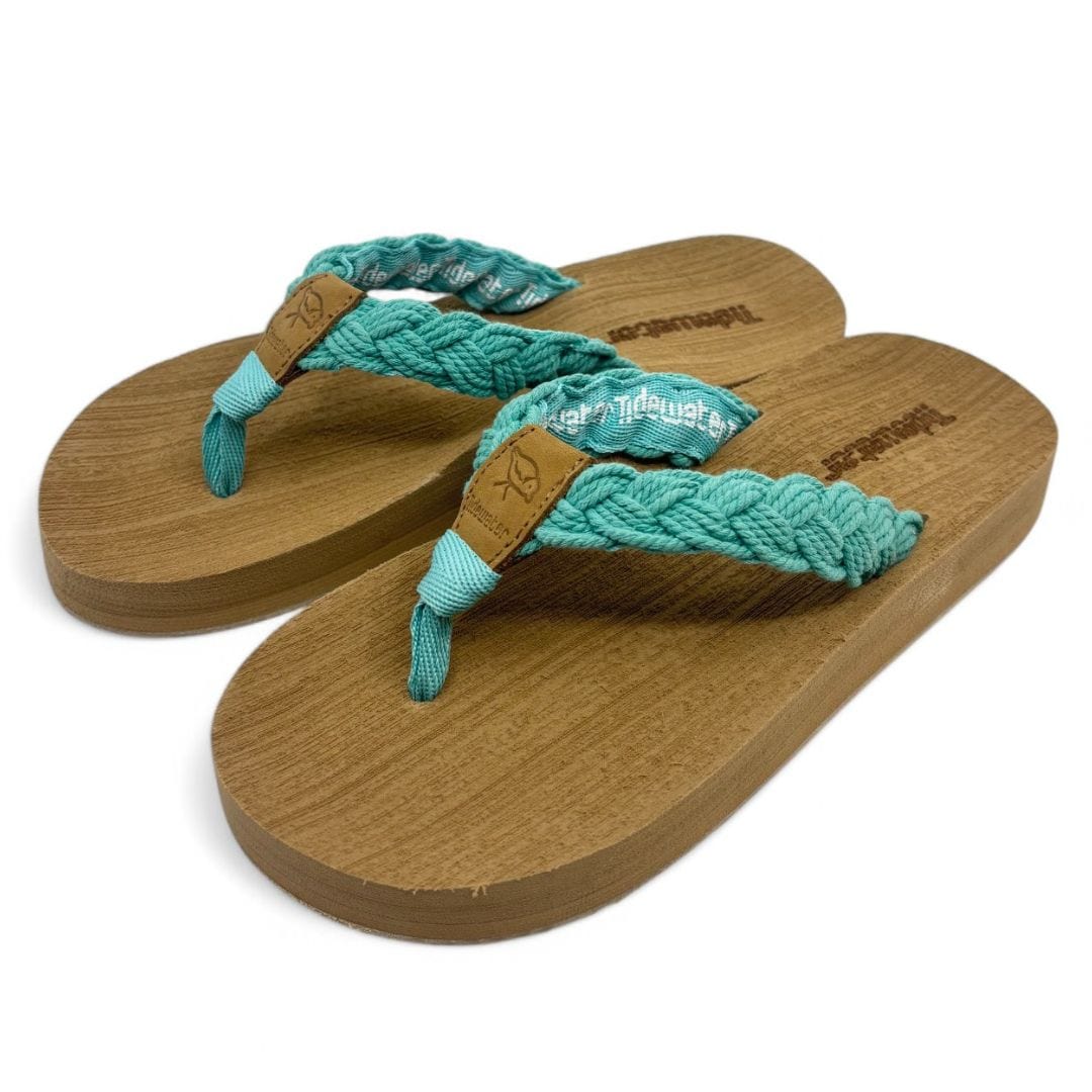 Harbor Pool Blue flip-flops featuring a braided teal strap and a wood-textured sole for stylish summer comfort.
