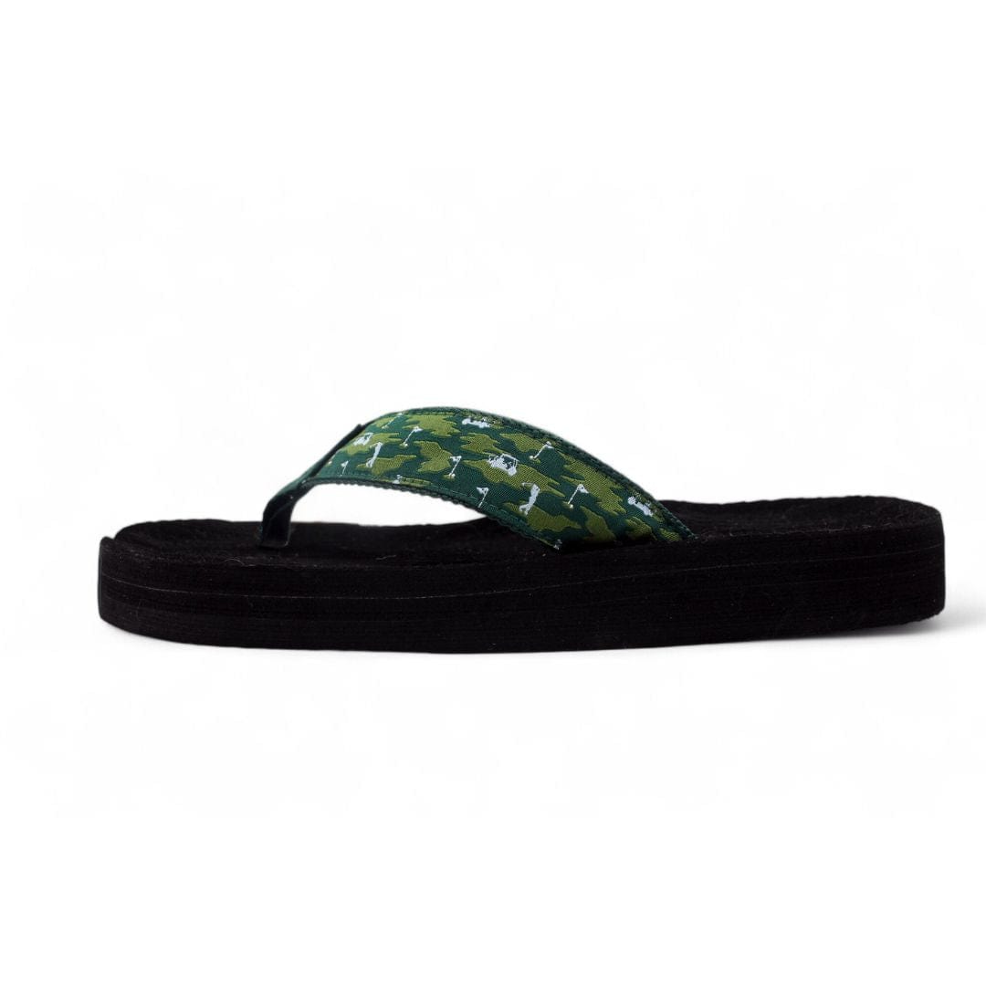 Black sandal with green pattern on a white background
