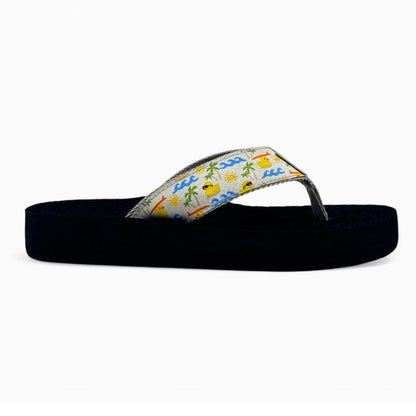 Black sandal with colorful flip-flop strap on a white background