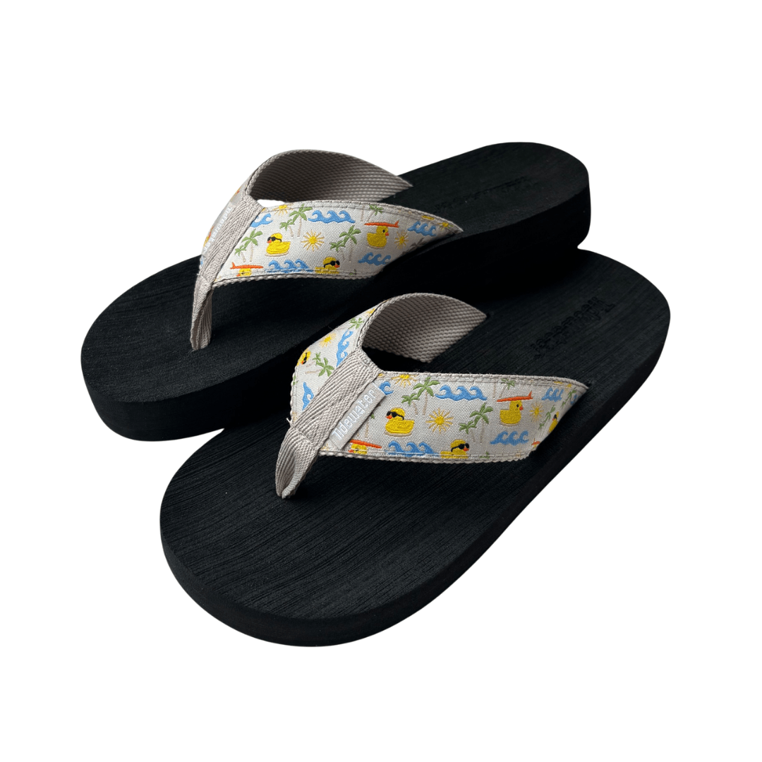 Colorful flip-flops featuring a fun beach-themed strap design, perfect for summer outings and casual wear.