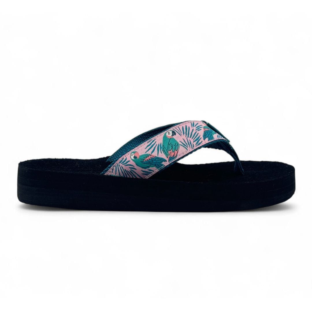 Black sandal with pink and blue design on a white background
