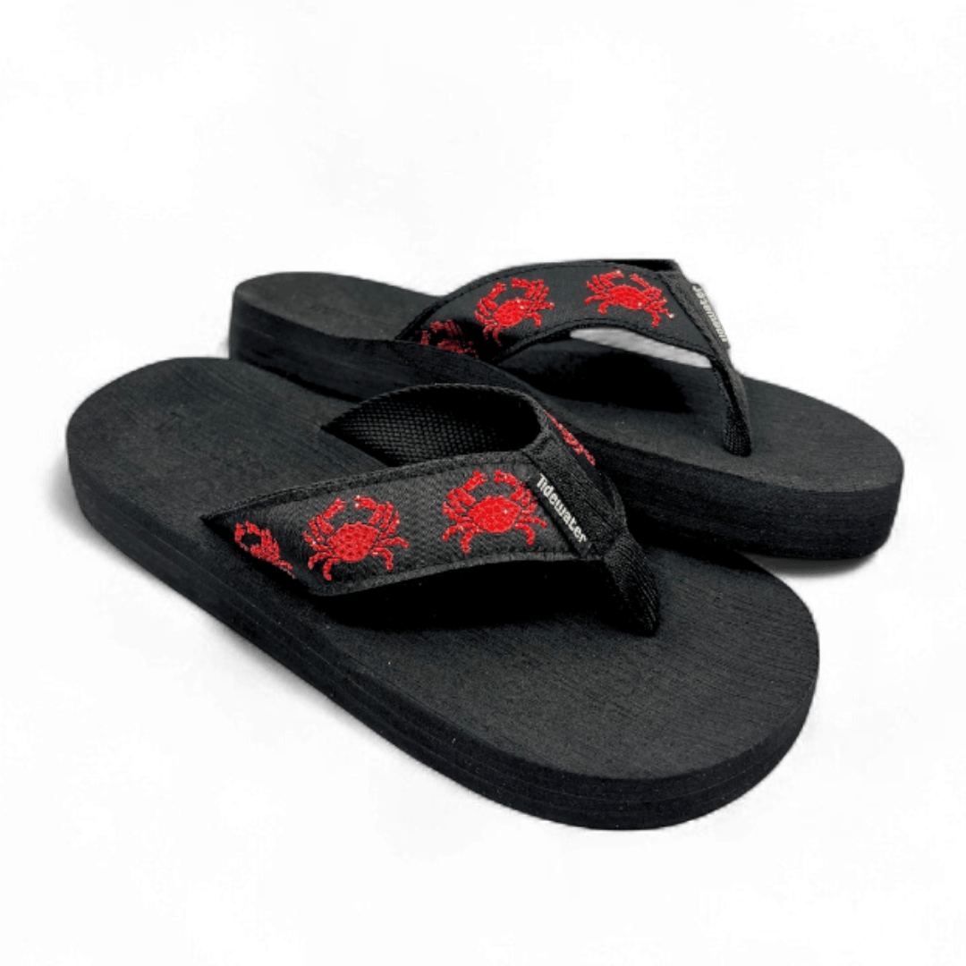 Black flip flops with red embroidered crab design on black straps and contoured black footbed

